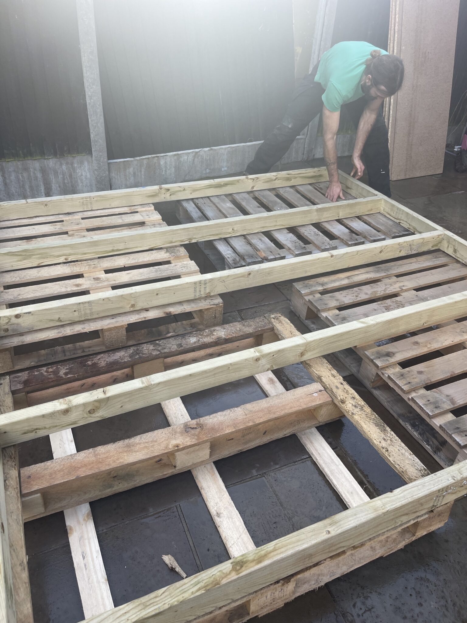 Building a raised shed base with treated timber bearers and reclaimed pallets for level support