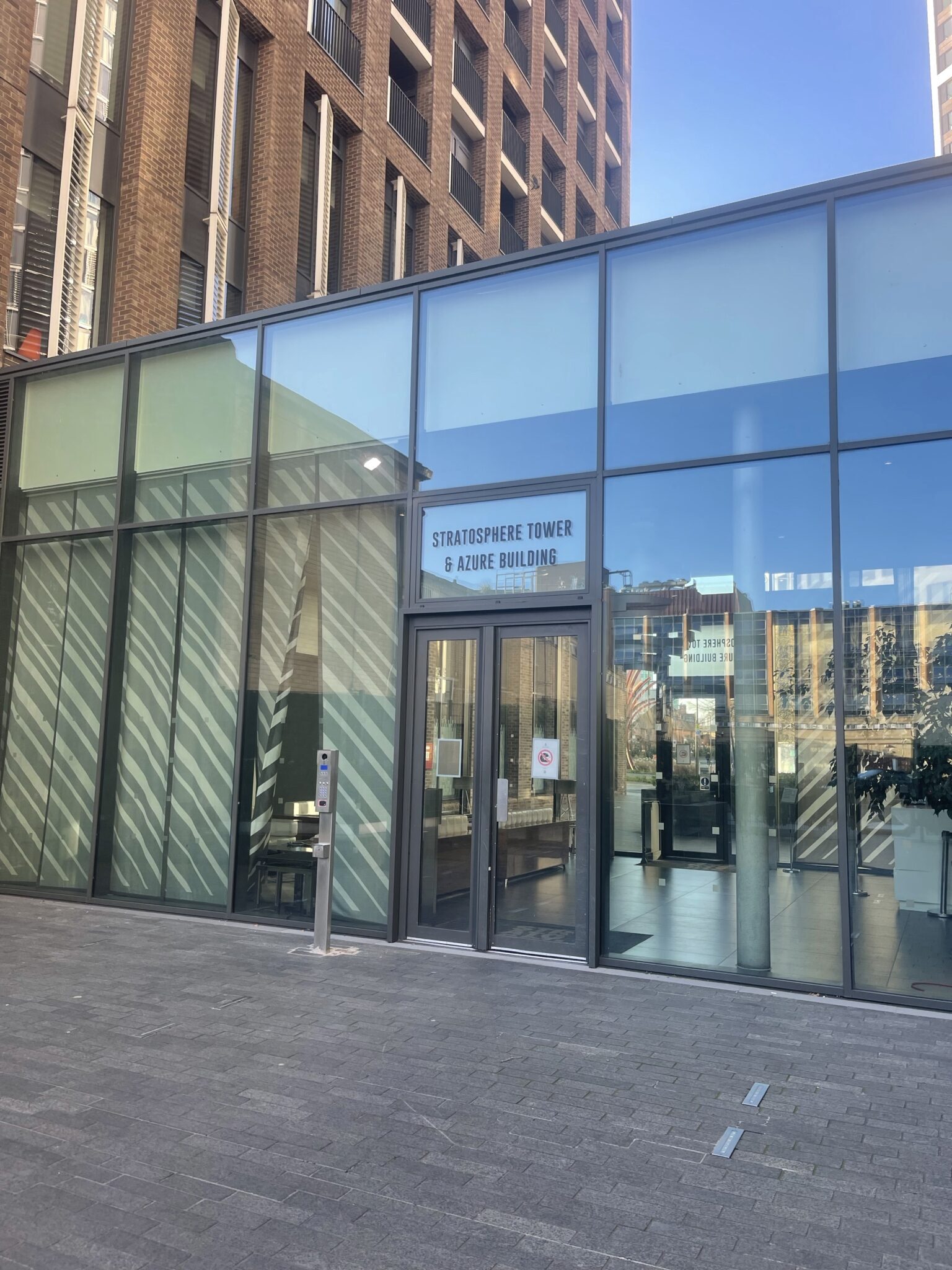 Entrance of Stratosphere Tower and Azure Building in Stratford E15, a modern London residential block with controlled access and lift based moving.