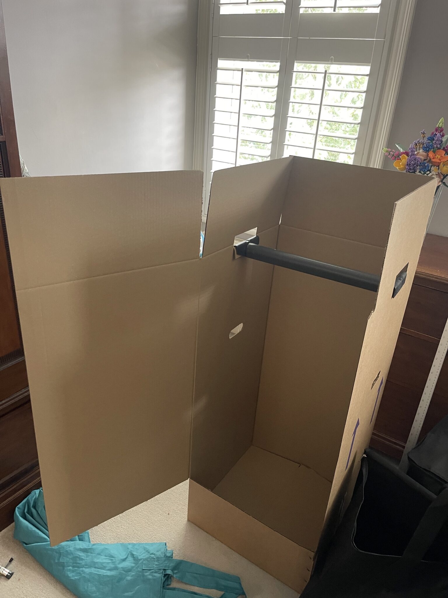 Heavy duty wardrobe box with hanging rail used for packing clothes during a Brighton move